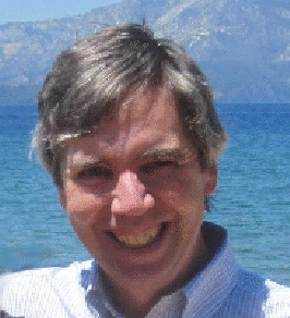 A picture of me, with gray hair, squinting in the sunshine.
